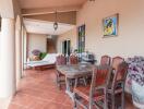 Outdoor patio with dining area and lounge chair