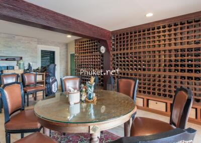 A wine cellar with a small dining table