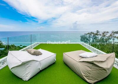 Terrace with sea view and lounge chairs