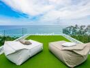 Terrace with sea view and lounge chairs