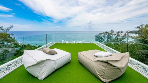 Terrace with sea view and lounge chairs