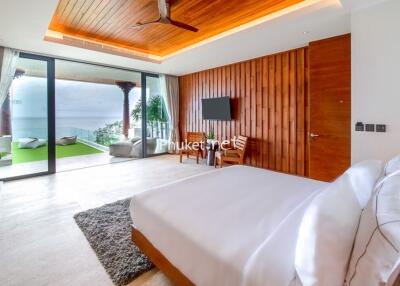 Spacious bedroom with ocean view and modern amenities