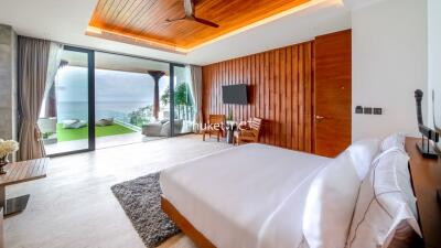 Spacious bedroom with ocean view and modern amenities