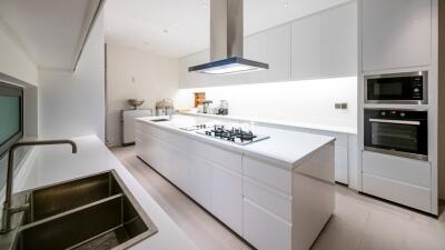 Modern kitchen with white cabinetry and appliances