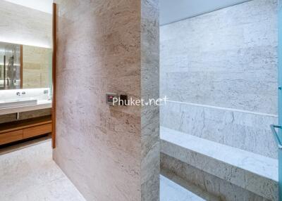 Modern bathroom with vanity and steam room