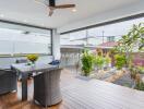 Covered terrace with outdoor dining area and garden view