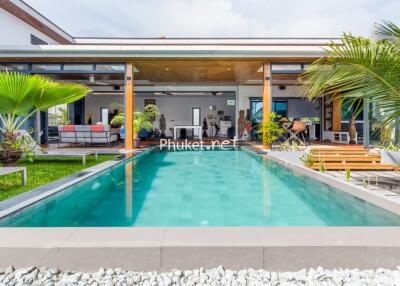 Modern house with swimming pool and outdoor seating area
