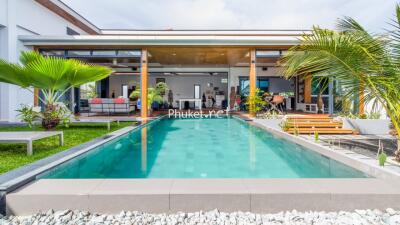 Modern house with swimming pool and outdoor seating area