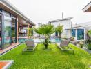 Modern outdoor area with pool and lounge chairs