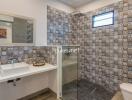 Modern bathroom with patterned tiles and a walk-in shower