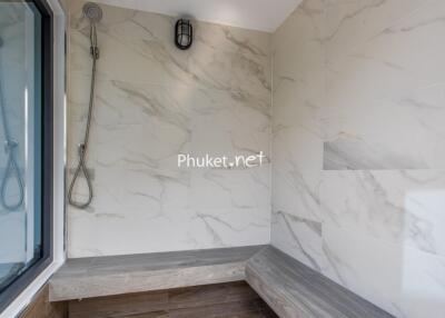 Modern bathroom with marble tiles and a shower