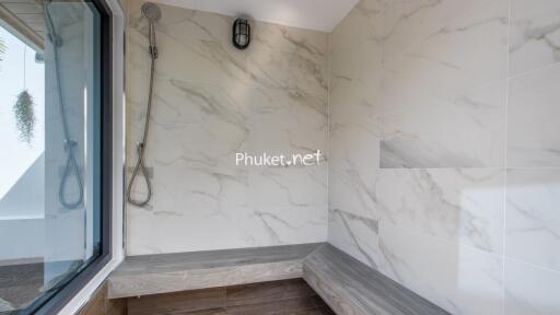 Modern bathroom with marble tiles and a shower