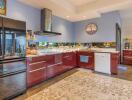 Modern kitchen with stainless steel appliances and red cabinets