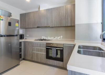 Modern kitchen with stainless steel appliances and wooden cabinets