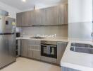 Modern kitchen with stainless steel appliances and wooden cabinets