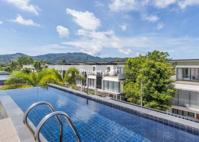 Rooftop pool with scenic view of surrounding area