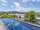 Rooftop pool with scenic view of surrounding area