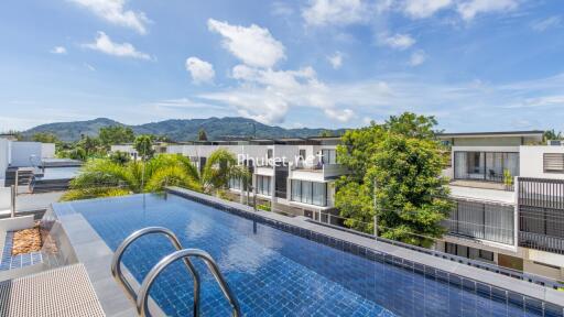 Rooftop pool with scenic view of surrounding area