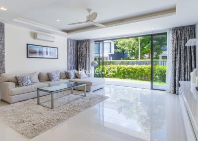 Modern living room with large windows and contemporary decor