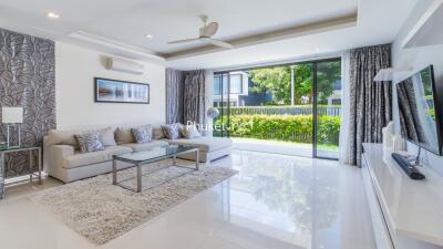 Modern living room with large windows and contemporary decor