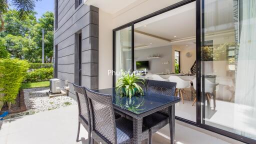 Outdoor patio area with a view into the living room