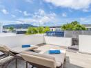 Outdoor patio with lounge chairs and a scenic view