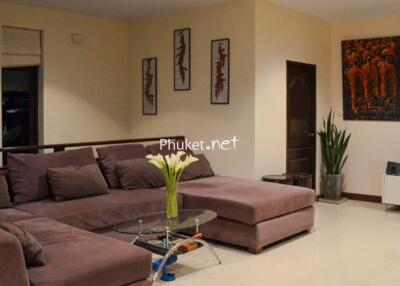 Modern living room with sectional sofa and wall art