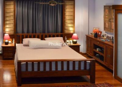 Cozy and well-lit bedroom with wooden furniture