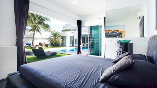 Modern bedroom with pool view