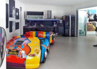 Artistic room with colorful car and modern art exhibits
