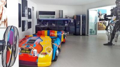 Artistic room with colorful car and modern art exhibits