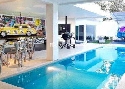 Modern outdoor area with pool and unique wall art