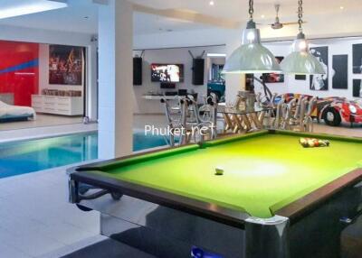 Recreation area with pool table and swimming pool