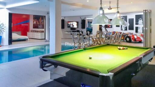 Recreation area with pool table and swimming pool