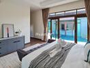 Modern bedroom with pool view and decorative elements