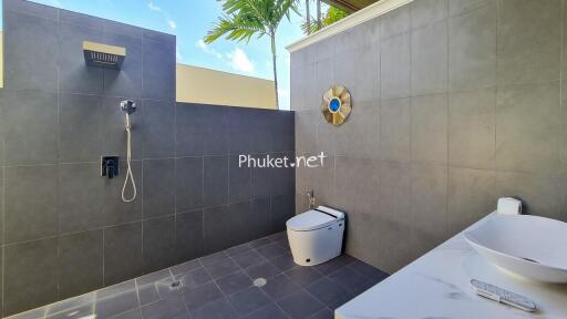 Modern outdoor bathroom with shower and toilet