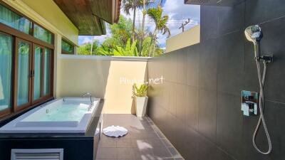 Modern outdoor bathroom with jacuzzi and shower