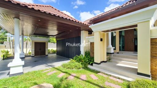 Front view of house with driveway and entrance