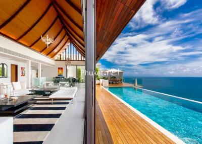 Spacious living room with ocean view and infinity pool