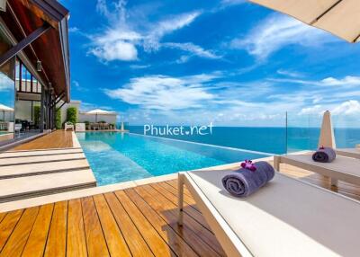 Luxurious outdoor pool area with ocean view