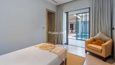 Bedroom with view of pool area