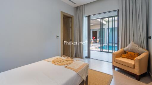 Bedroom with view of pool area