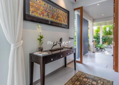 Modern hallway with decorative elements leading to an outdoor area