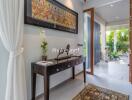 Modern hallway with decorative elements leading to an outdoor area