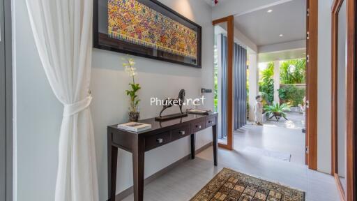 Modern hallway with decorative elements leading to an outdoor area