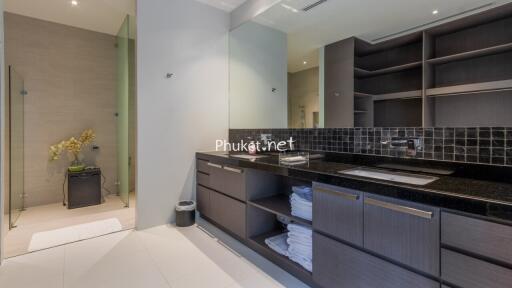 Modern bathroom with dual sinks and storage