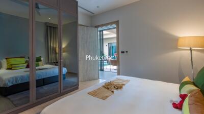 Cozy bedroom with mirrored wardrobe and modern decor