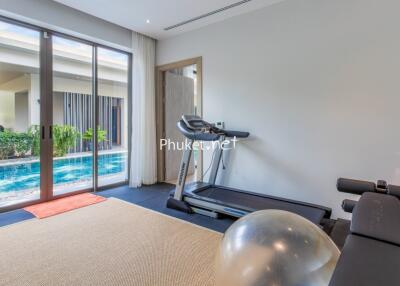Home gym with pool view
