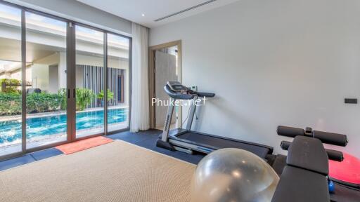 Home gym with pool view