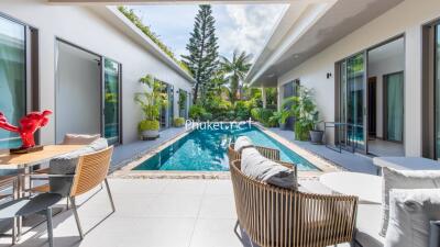 Modern outdoor space with swimming pool and seating area